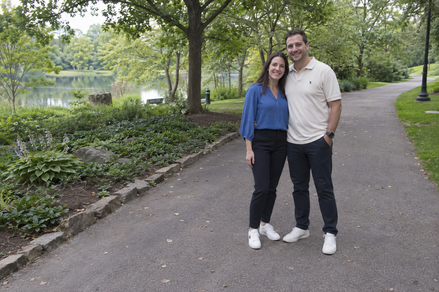 Fictional couple on a park path with open space around them